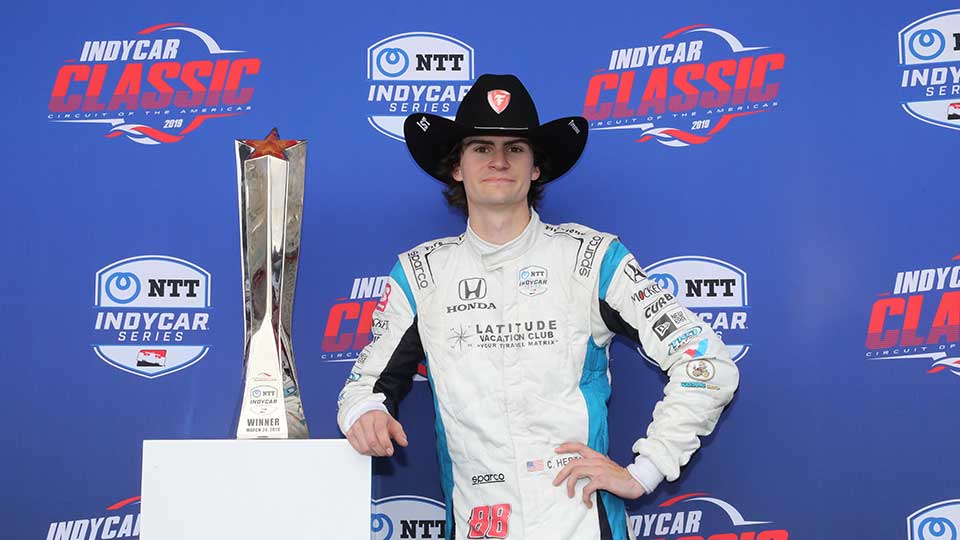 Colton Herta poses with his trophy at the circuit of the americas