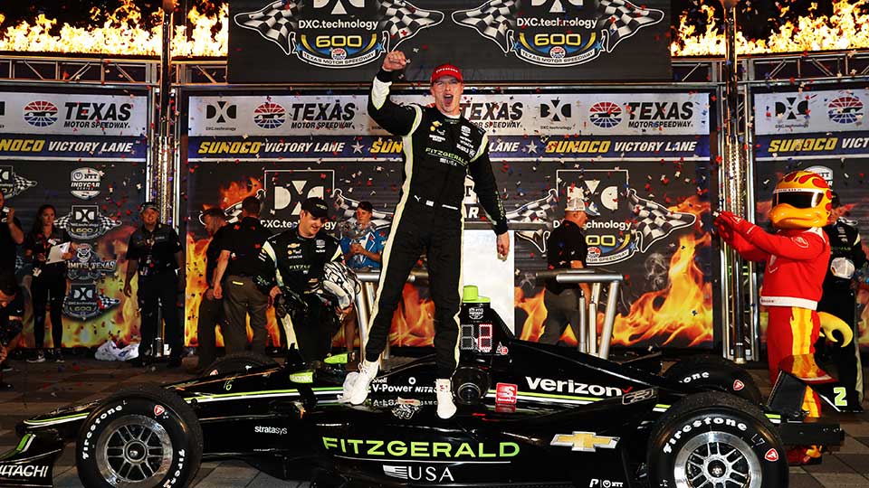 Josef Newgarden celebrates on the podium in Texas