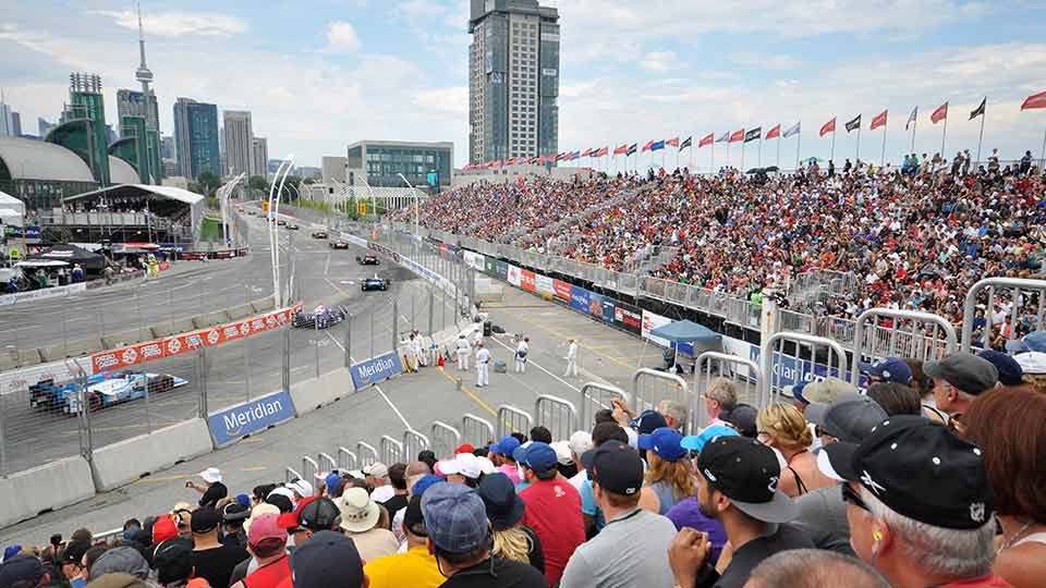 IndyCars on track shot from the view of the grandstands of the Honda Indy Toronto