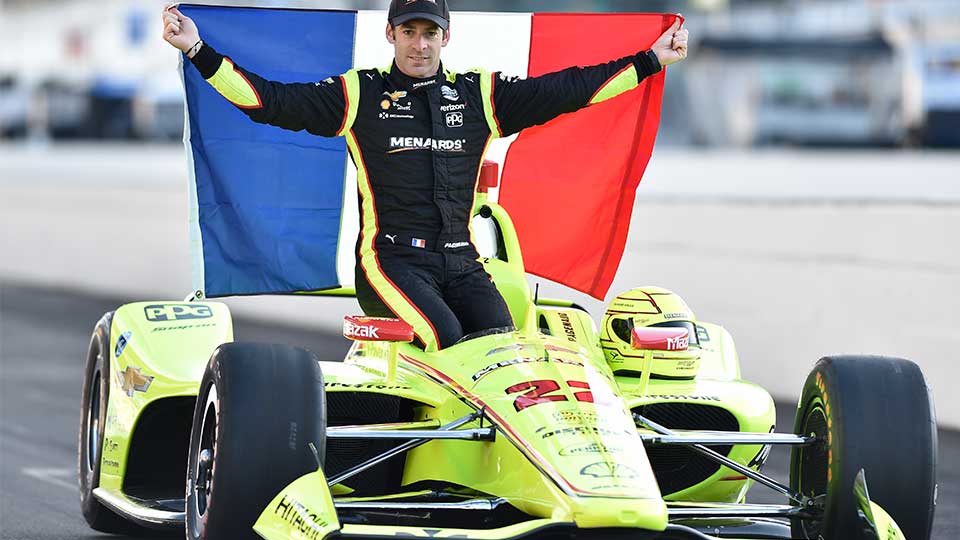 Simon Pagenaud waves his native French flag