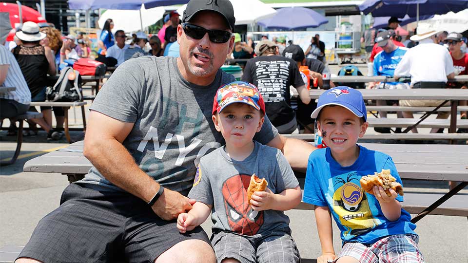 A father and his kids enjoying the Honda Indy Toronto